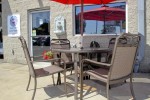 Outdoor waiting table and chairs in our Northridge, CA Cadillac Auto Repair Shop